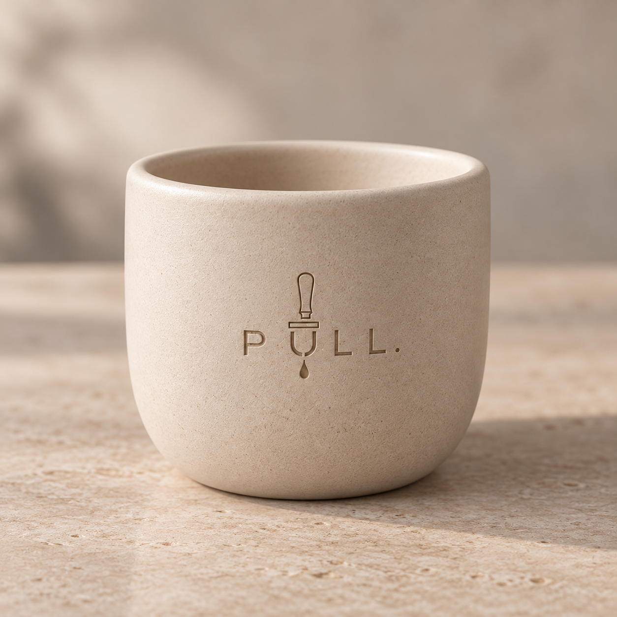 Full rounded ivory ceramic mug with tone-on-tone engraved Pull logo